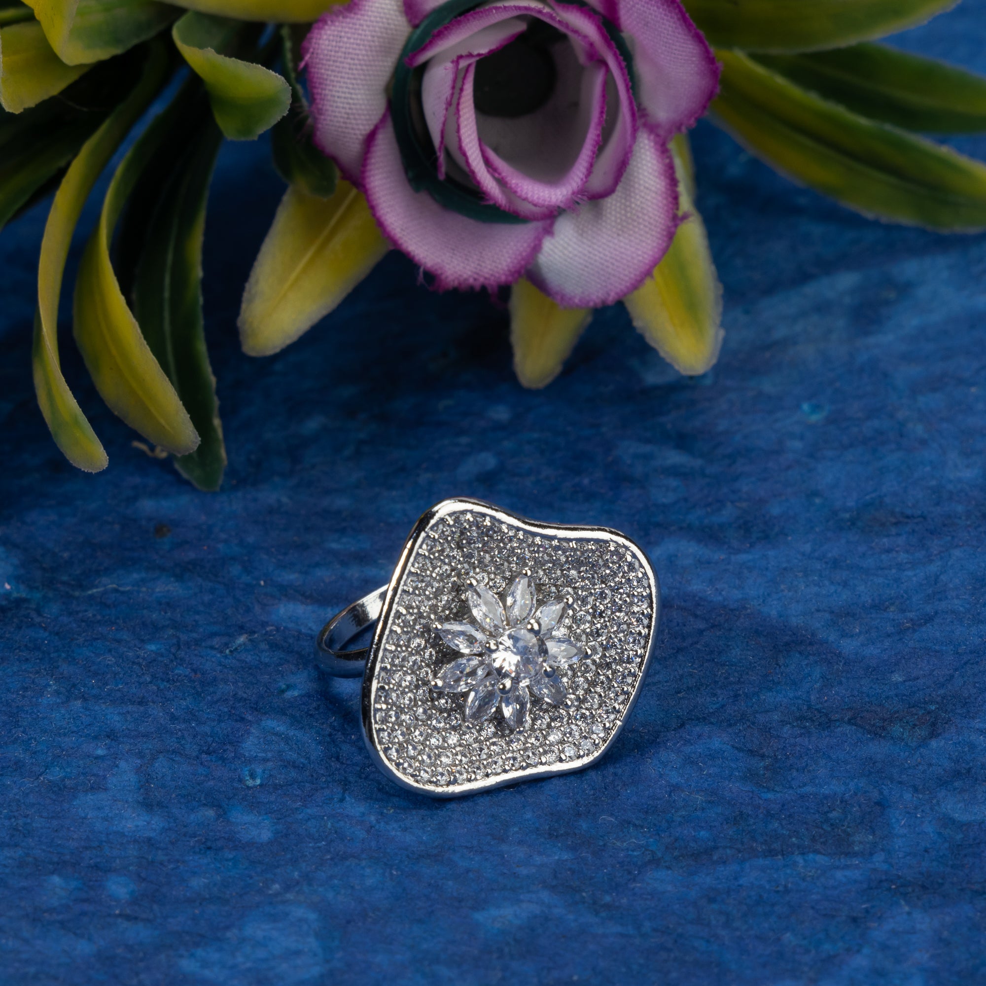 Silver zircon finger ring offers a dazzling design for a glamorous party-ready look.