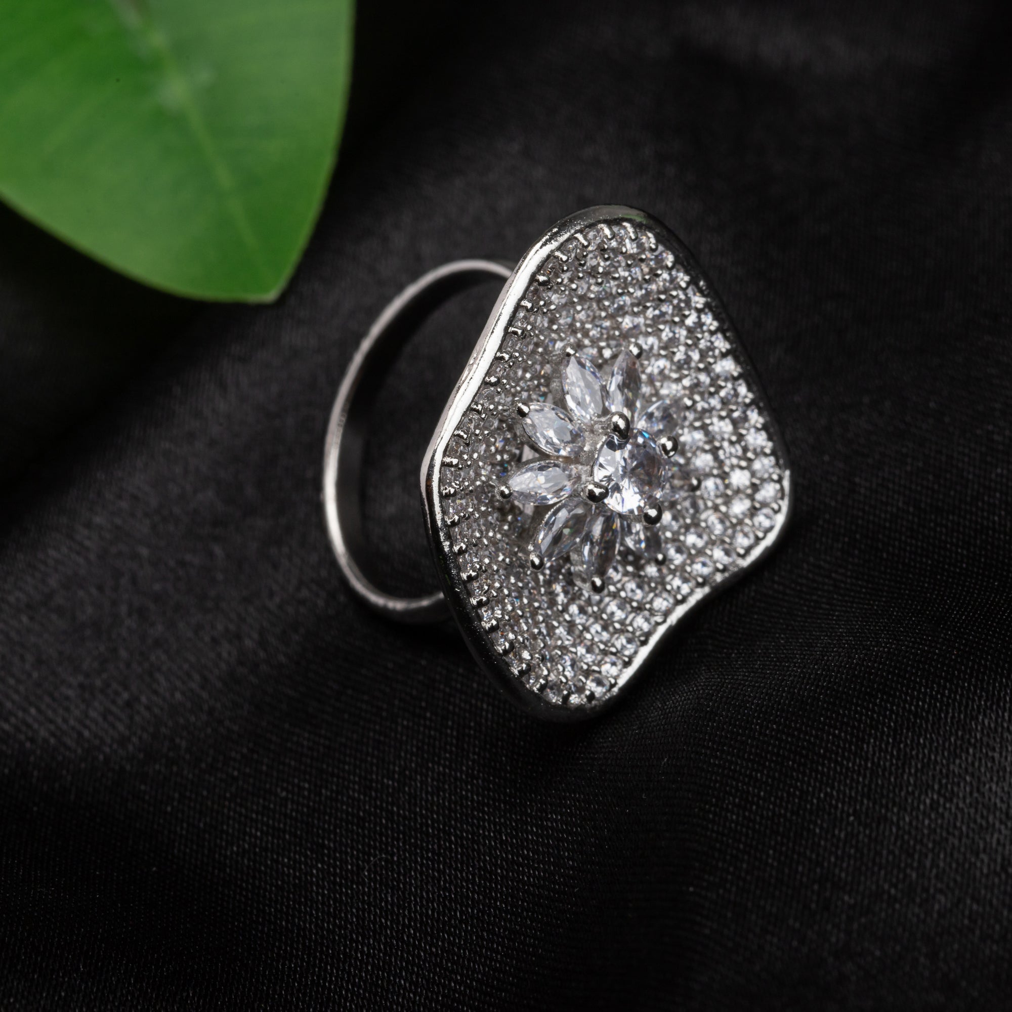 Silver zircon finger ring offers a dazzling design for a glamorous party-ready look.