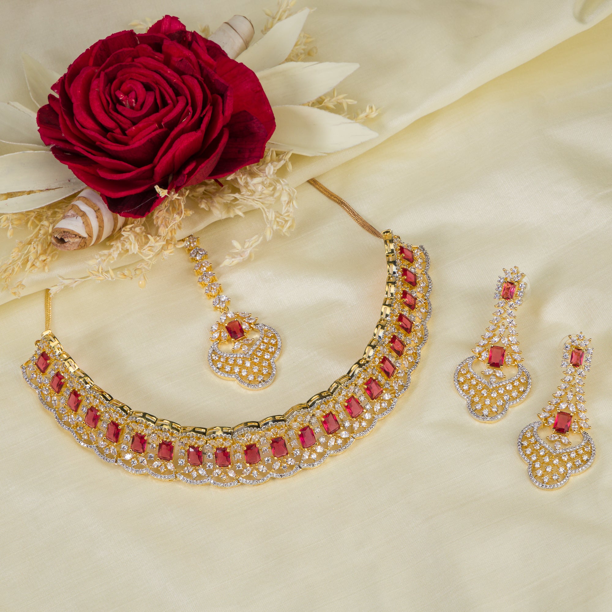 Red zircon bridal necklace set features intricate designs, perfect for a regal wedding look.