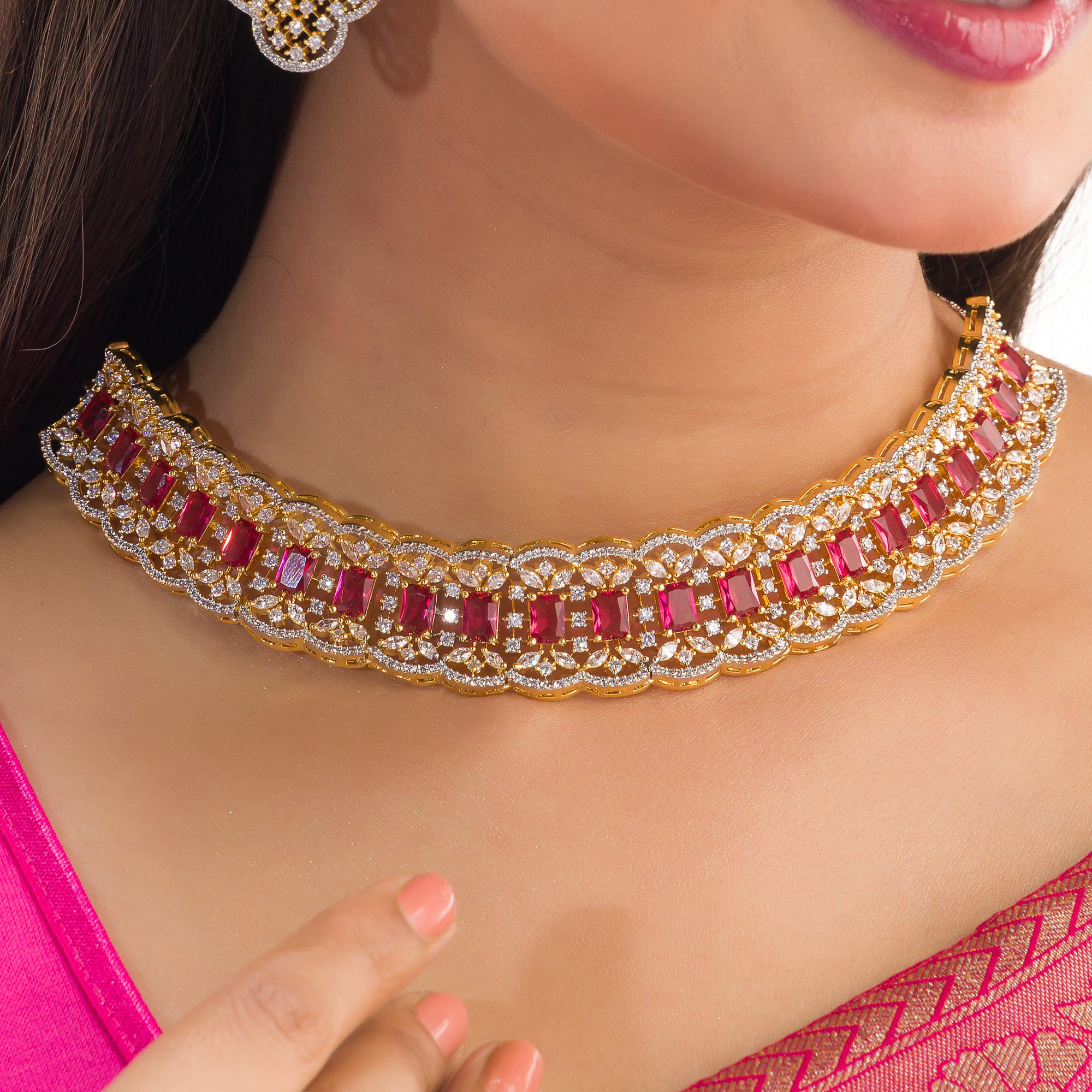 Red zircon bridal necklace set features intricate designs, perfect for a regal wedding look.