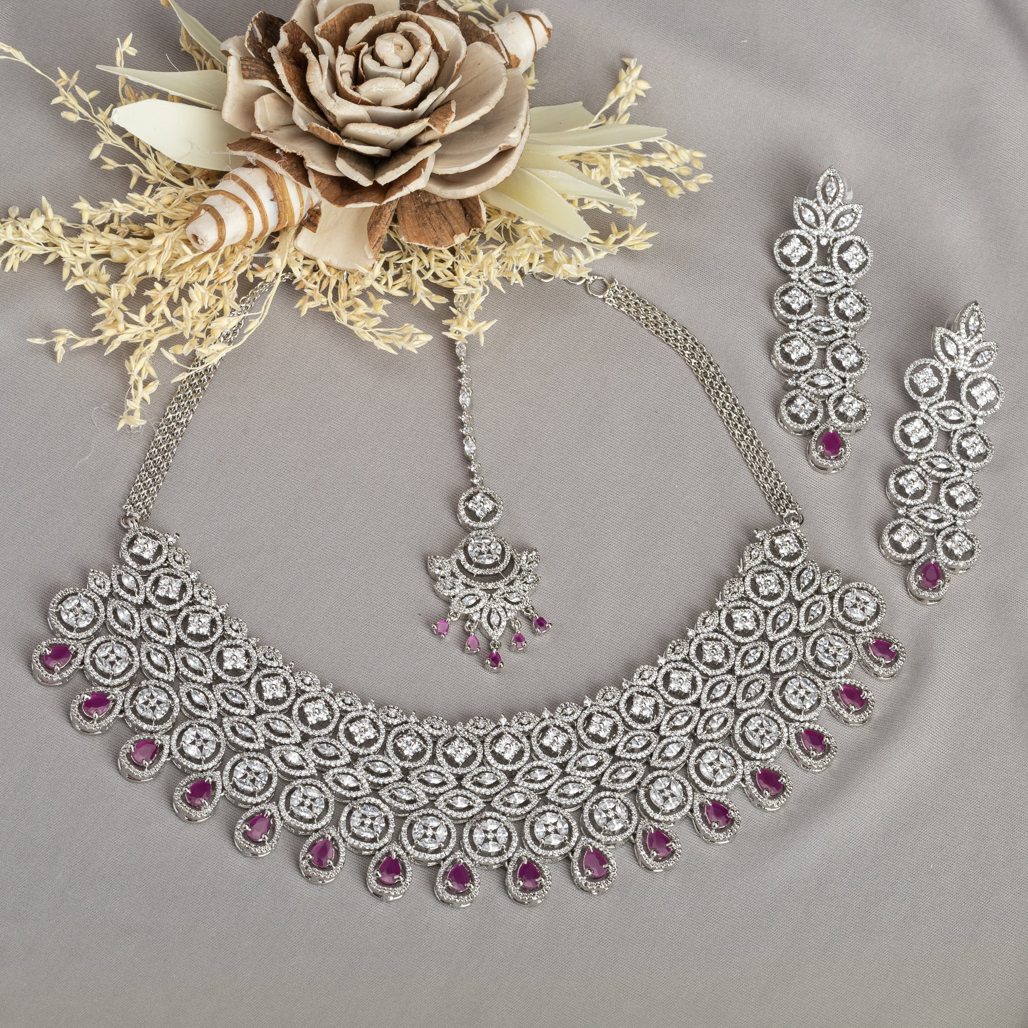 Pink zircon bridal necklace set with intricate stone design.