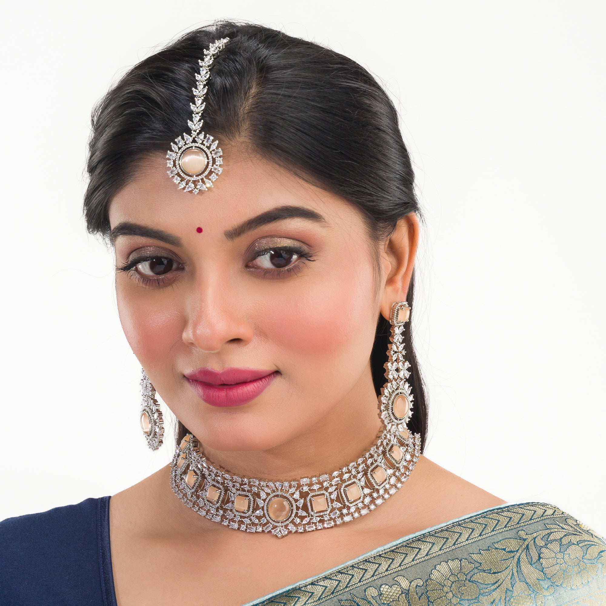 Salmon zircon bridal choker set with earrings and maangtika.