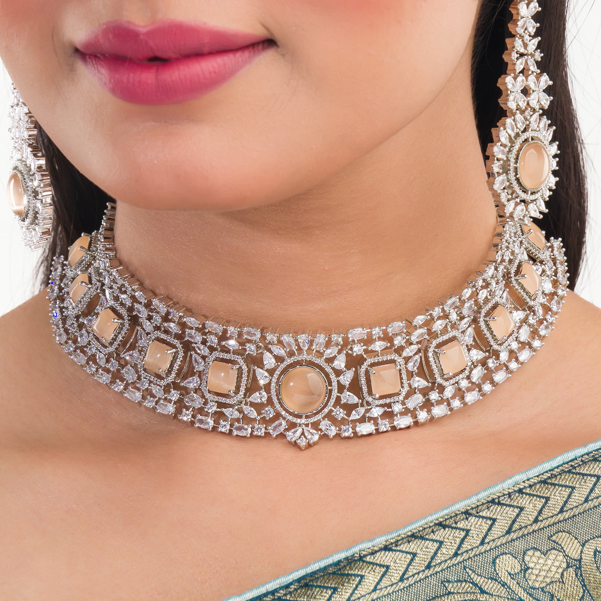 Salmon zircon bridal choker set with earrings and maangtika.