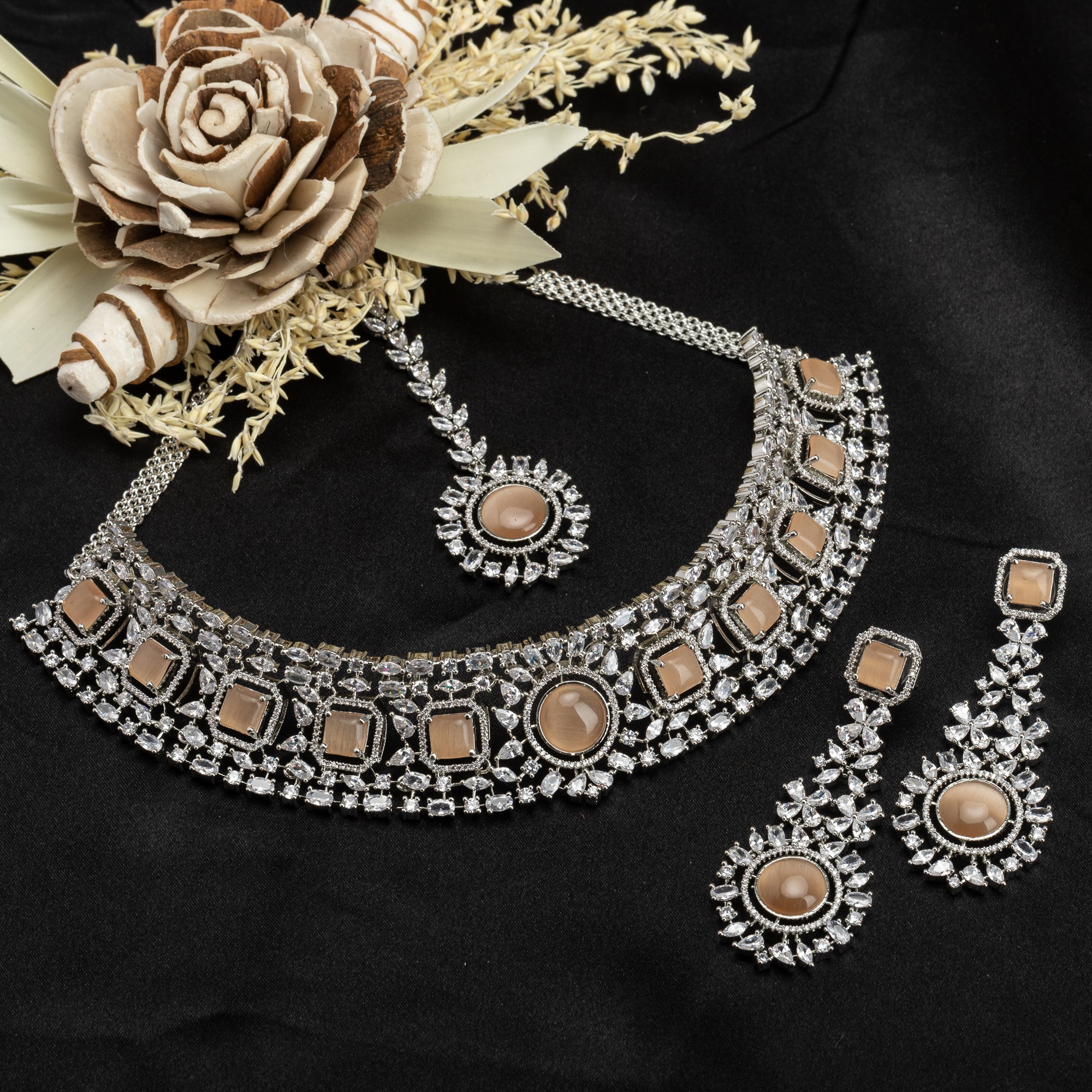 Salmon zircon bridal choker set with earrings and maangtika.