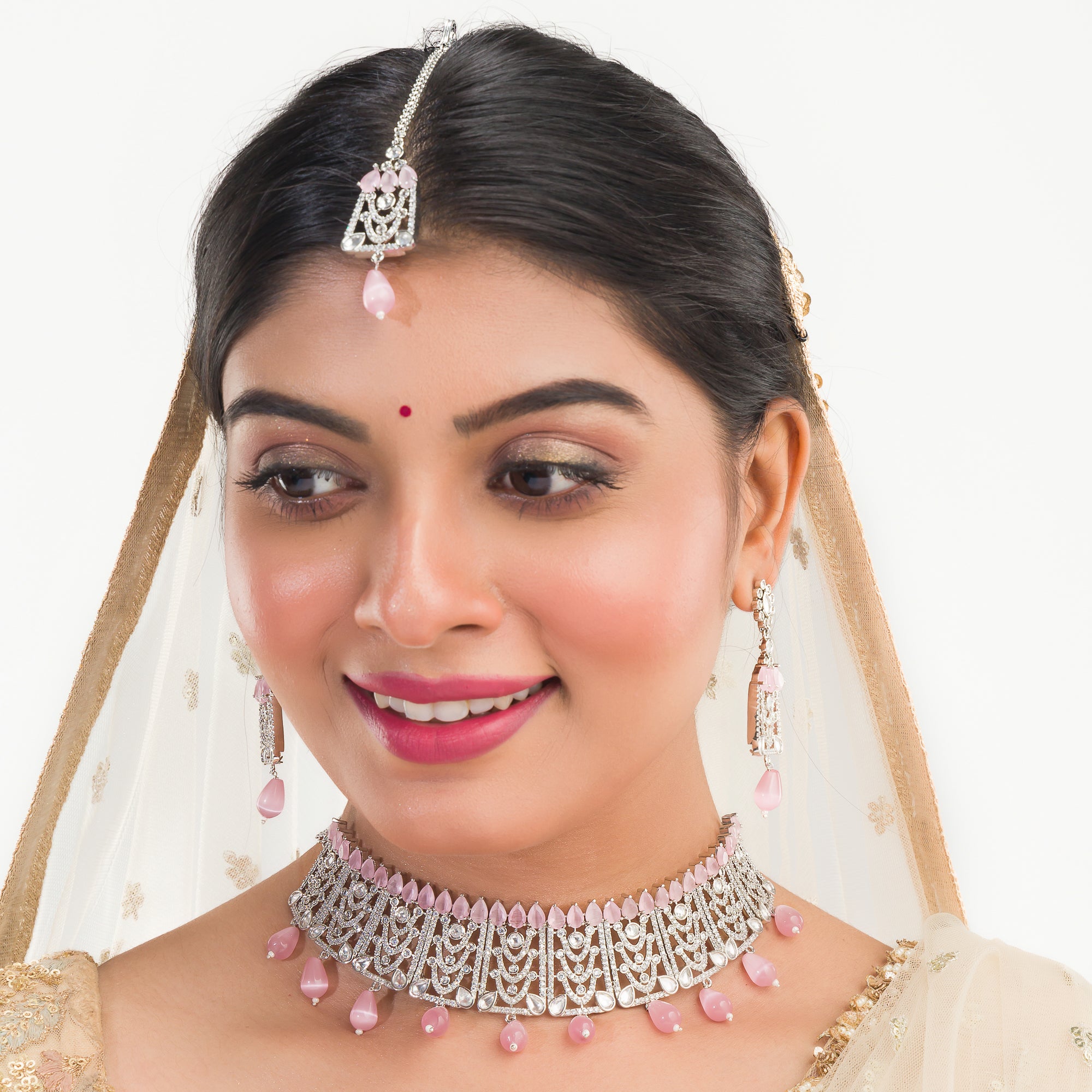Pink pearl and white zircon bridal choker set with earrings and maangtika.