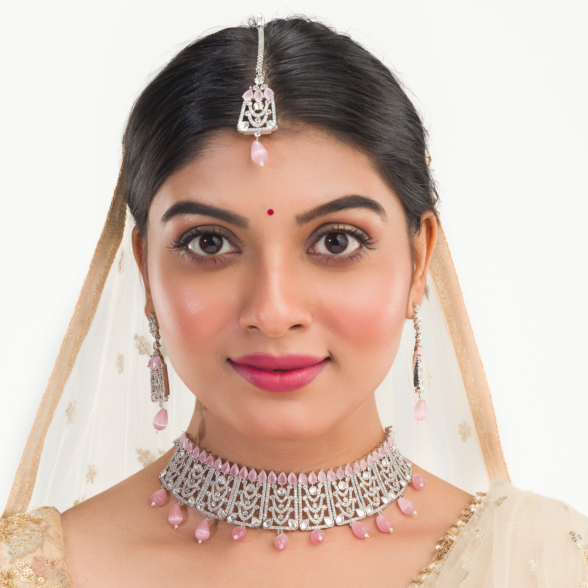 Pink pearl and white zircon bridal choker set with earrings and maangtika.