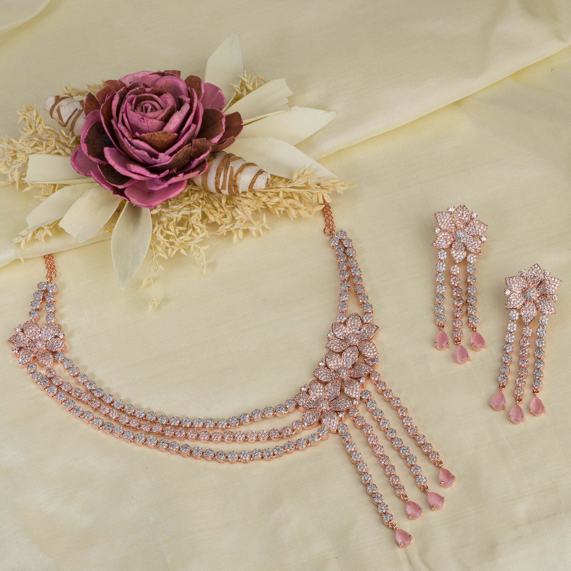 Orchid zircon necklace set with rose gold polish for a charming, elegant look.