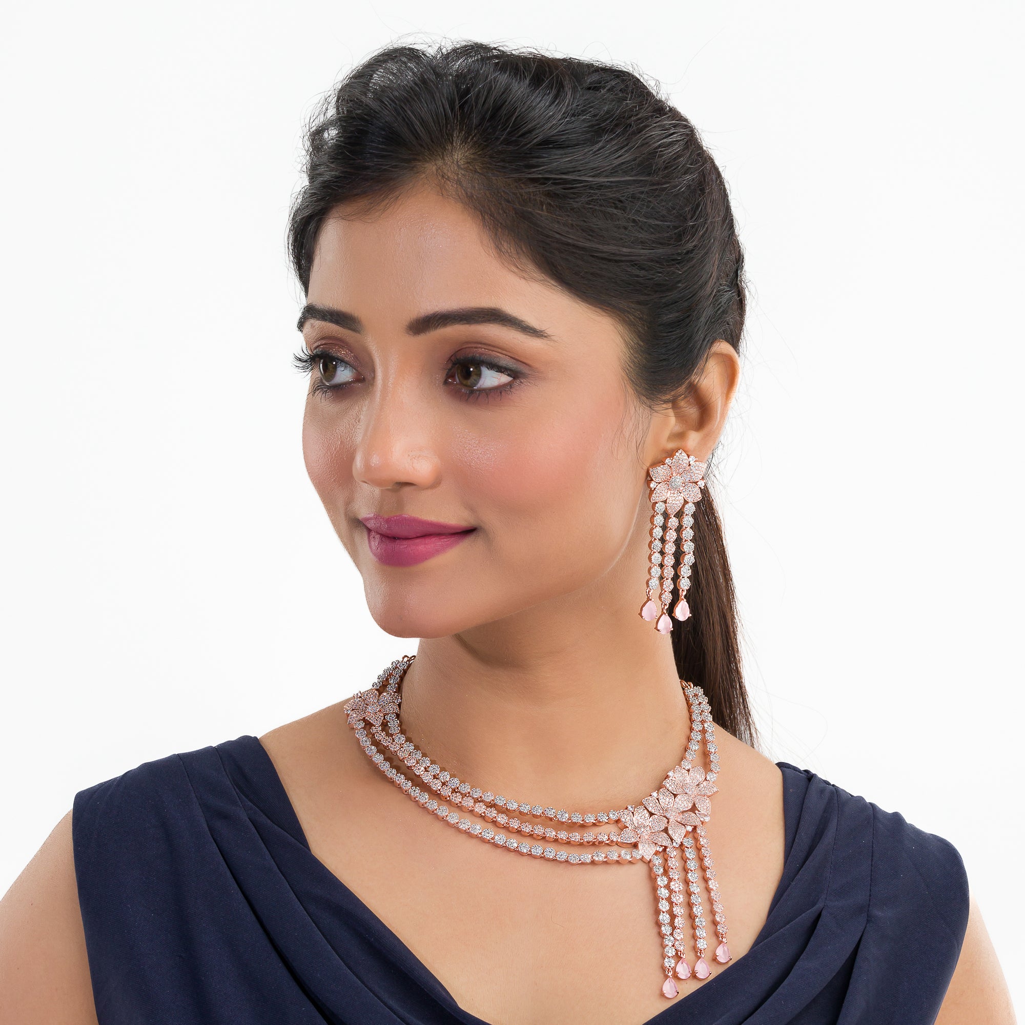 Orchid zircon necklace set with rose gold polish for a charming, elegant look.