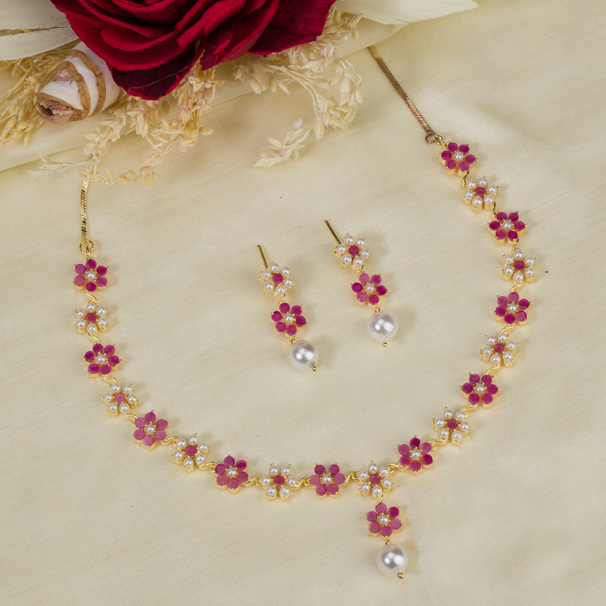 Pink pearl floral necklace set with matching earrings for timeless elegance and beauty.