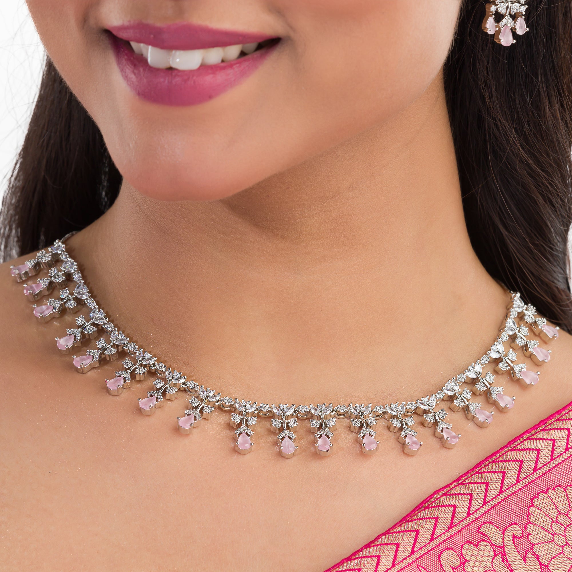 Pink and white zircon necklace set with matching earrings, offering a delicate and elegant design.