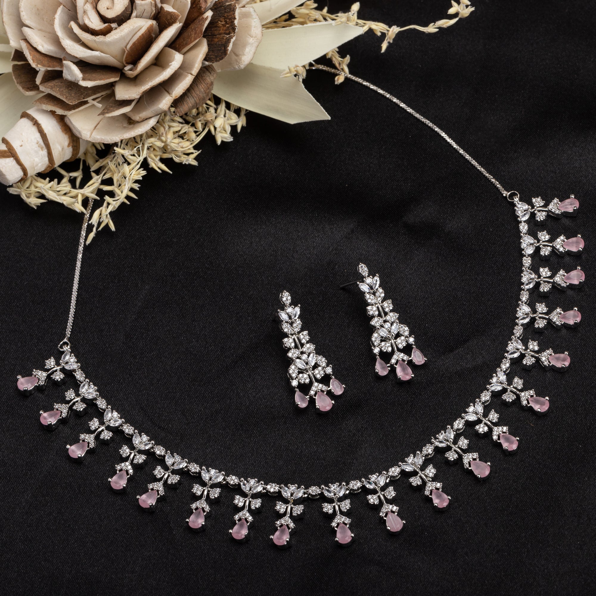 Pink and white zircon necklace set with matching earrings, offering a delicate and elegant design.