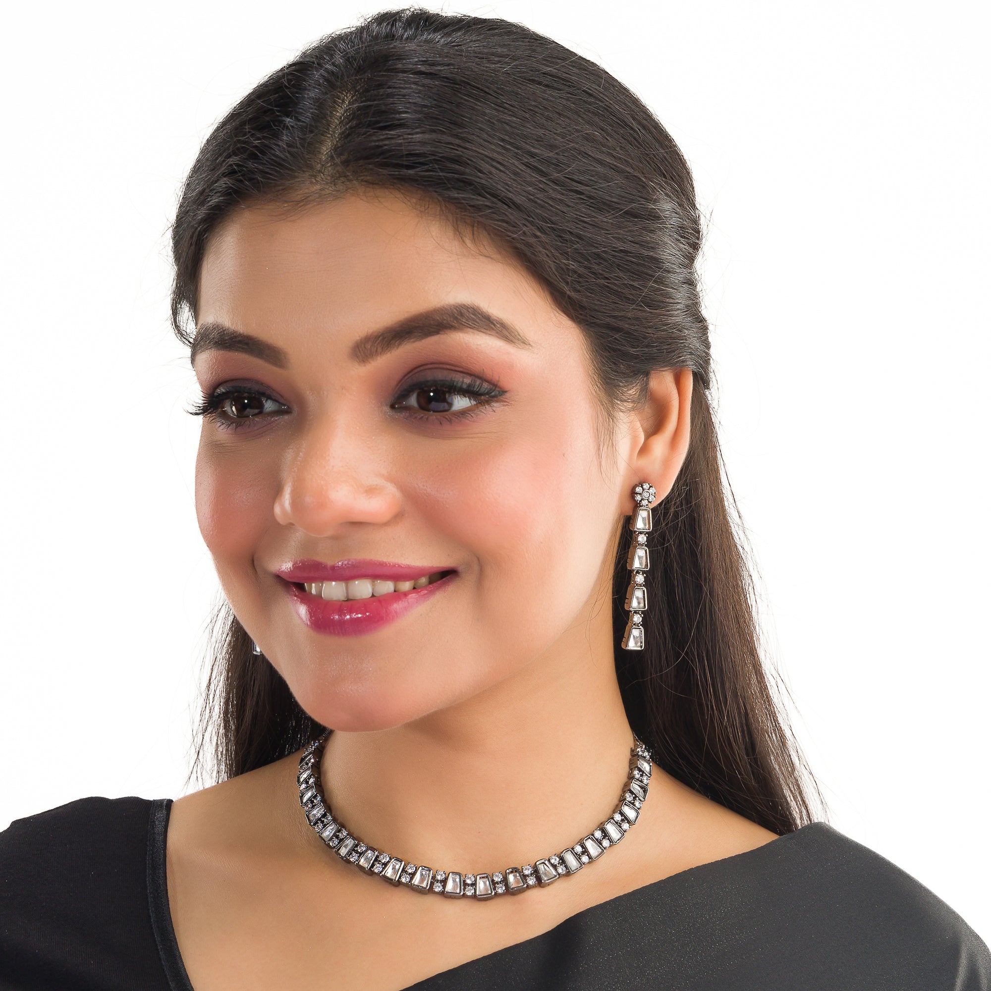 Black polished zircon necklace set with white stones for a sleek and striking design.