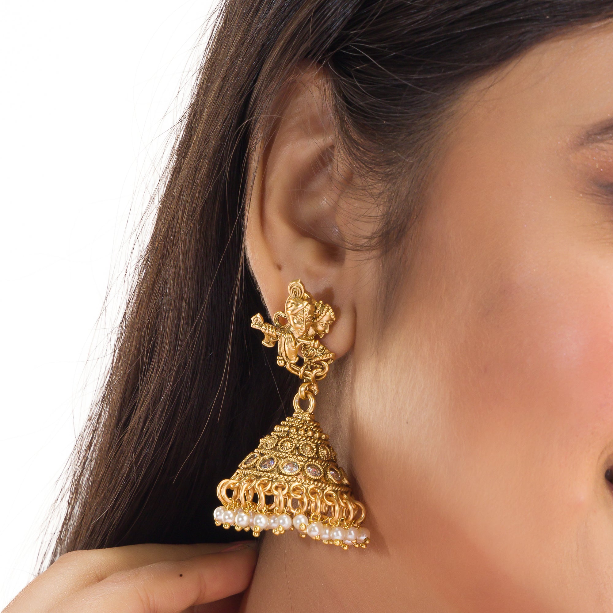 Golden Radha Krishna long necklace set with pearls and matching jhumkas for a divine festive look.