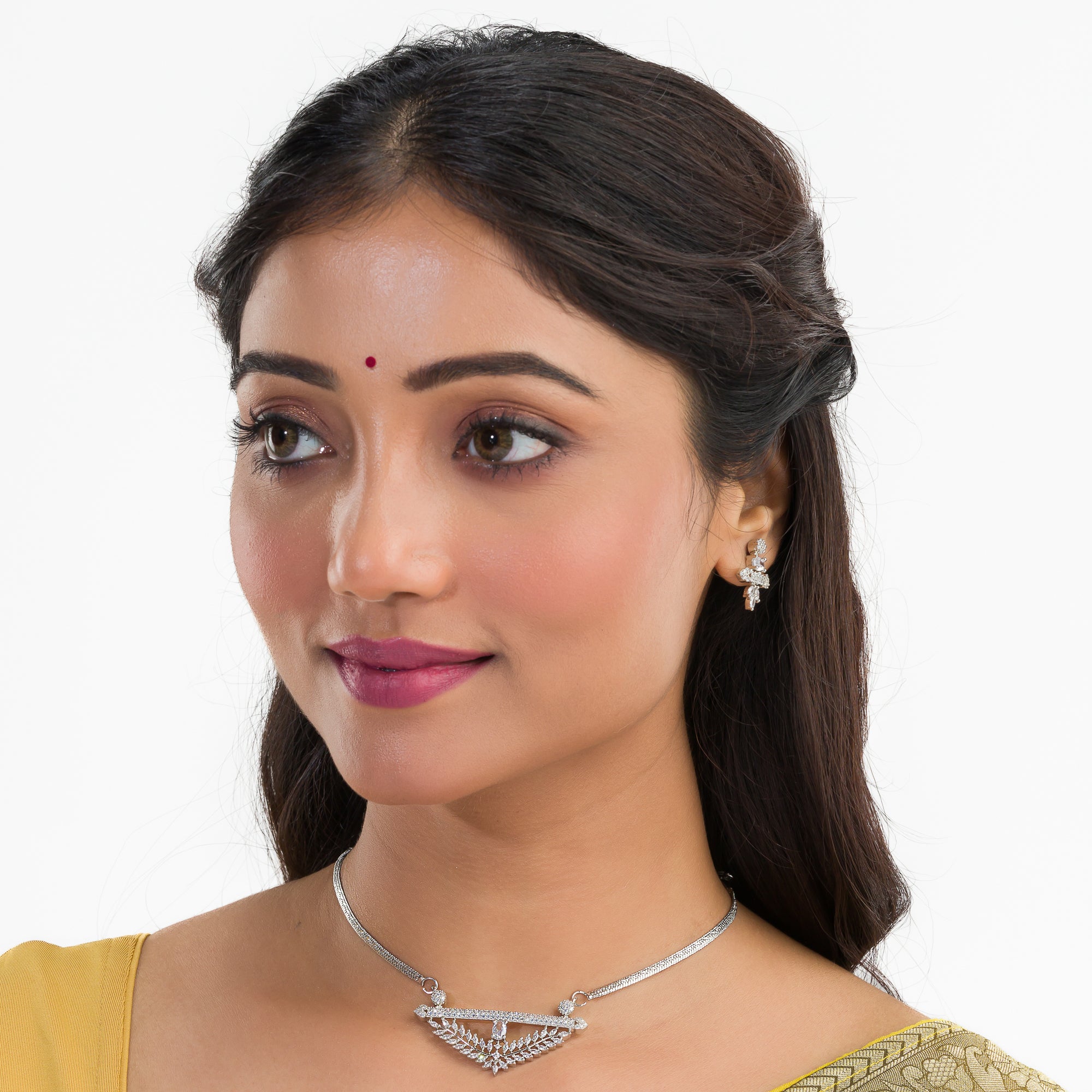 Silver zircon pendant set with matching earrings for refined elegance and luxury.