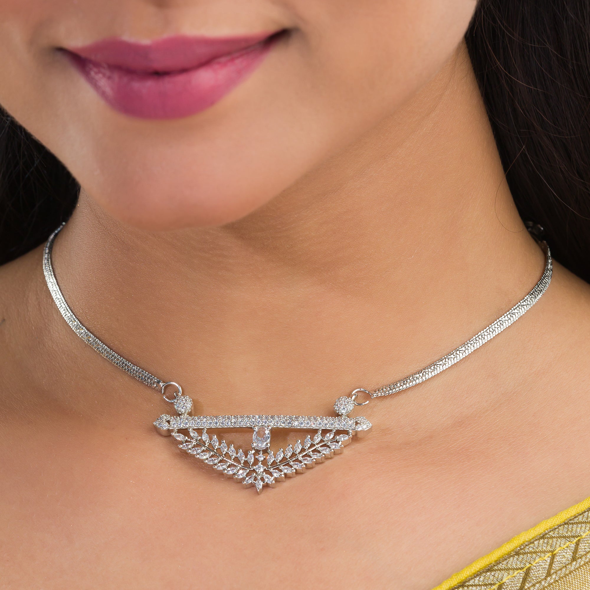 Silver zircon pendant set with matching earrings for refined elegance and luxury.