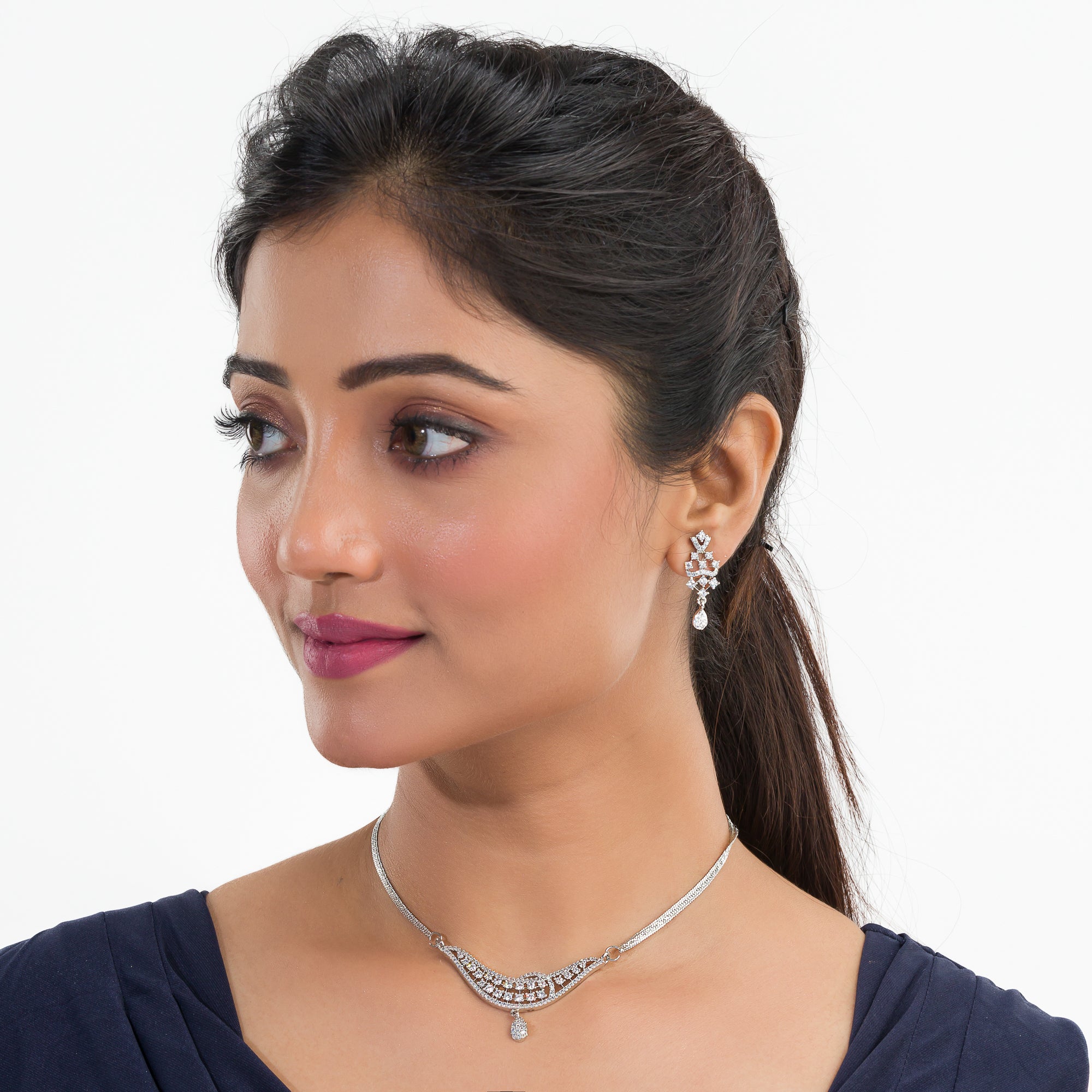 Sparkling silver zircon pendant set with earrings, adding a touch of luxury to any outfit.