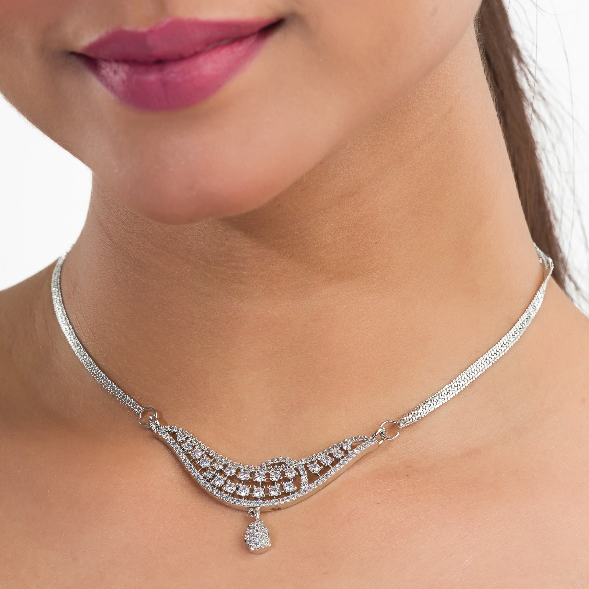 Sparkling silver zircon pendant set with earrings, adding a touch of luxury to any outfit.