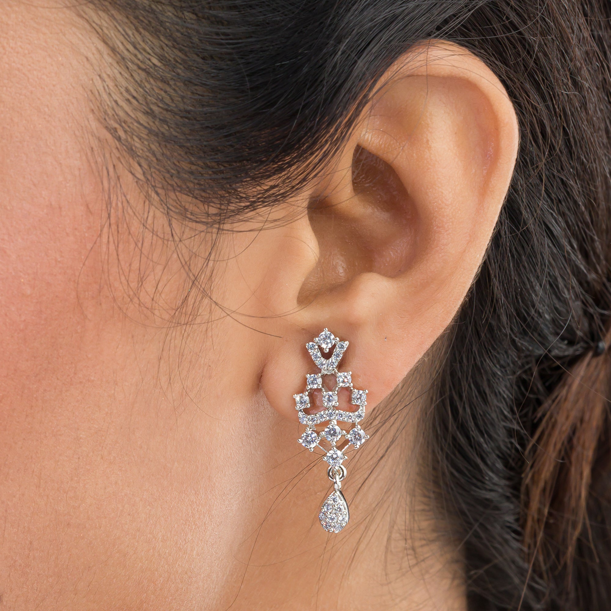 Sparkling silver zircon pendant set with earrings, adding a touch of luxury to any outfit.