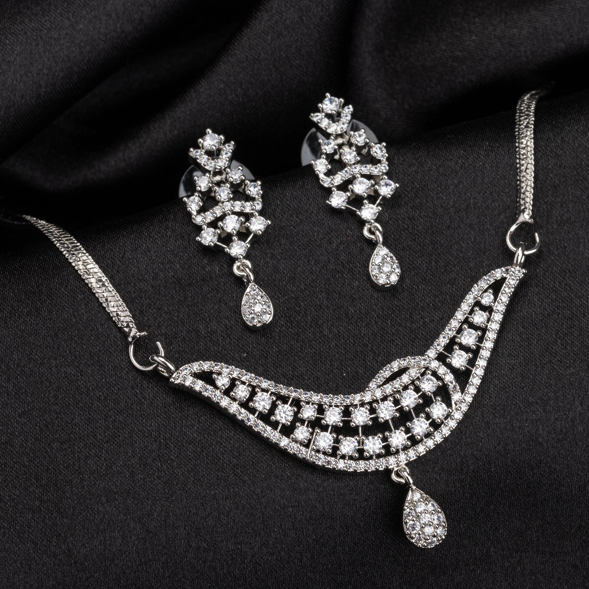 Sparkling silver zircon pendant set with earrings, adding a touch of luxury to any outfit.