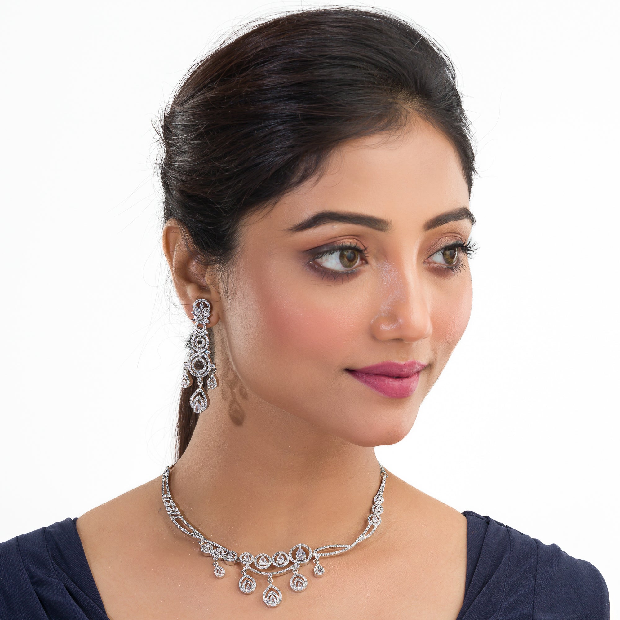 Zircon-studded silver necklace set with a dazzling, refined design for parties.