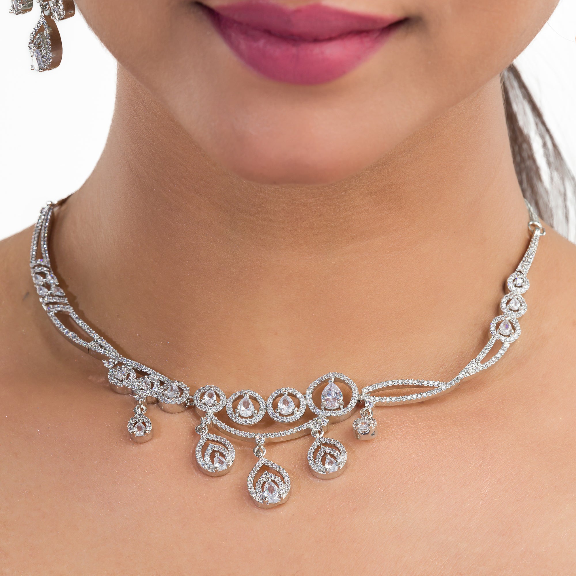 Zircon-studded silver necklace set with a dazzling, refined design for parties.