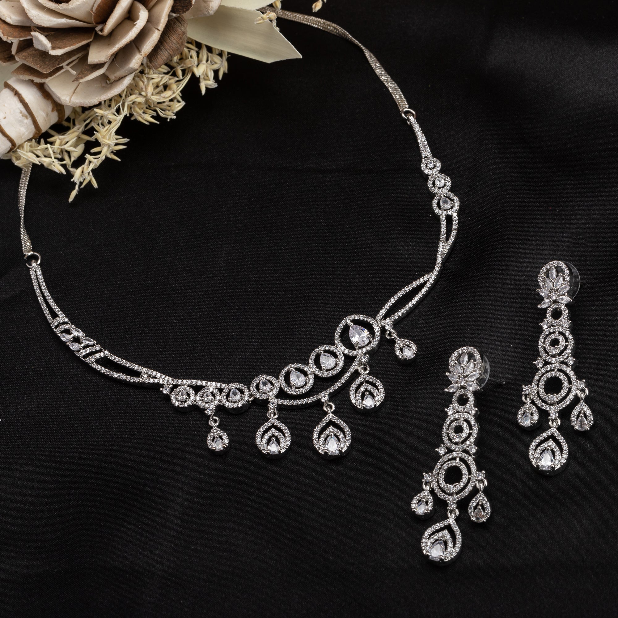 Zircon-studded silver necklace set with a dazzling, refined design for parties.