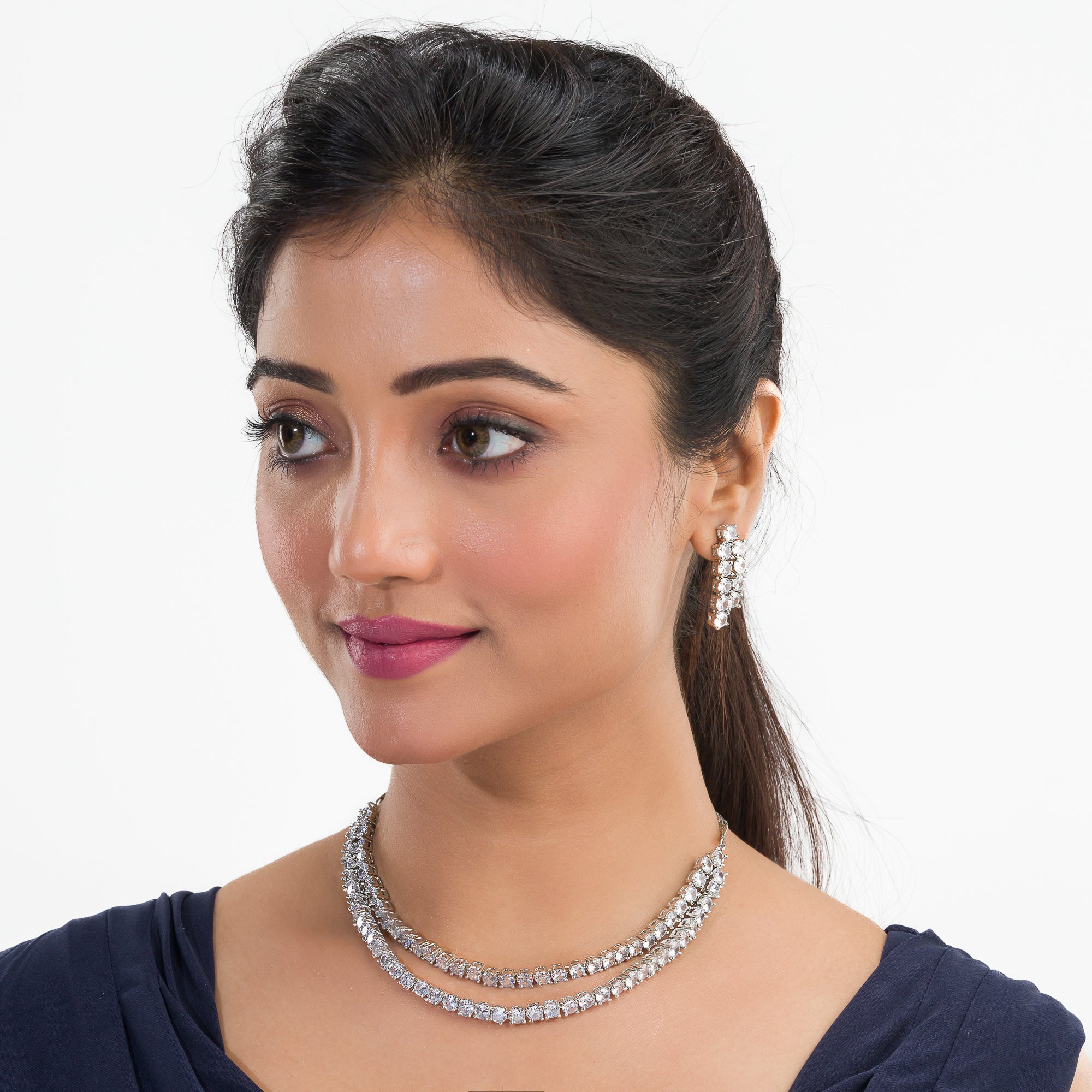 Double-layer silver necklace set with white zircon stones and matching earrings for sophistication.