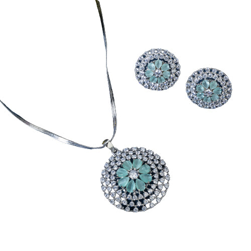 Floral zircon pendant set with turquoise and white stones, paired with matching earrings.