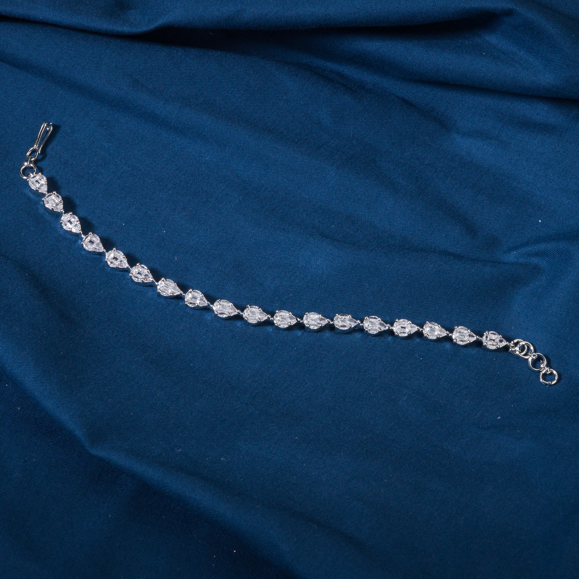 Silver zircon-studded chain bracelet, perfect for adding shimmer to your party wear.