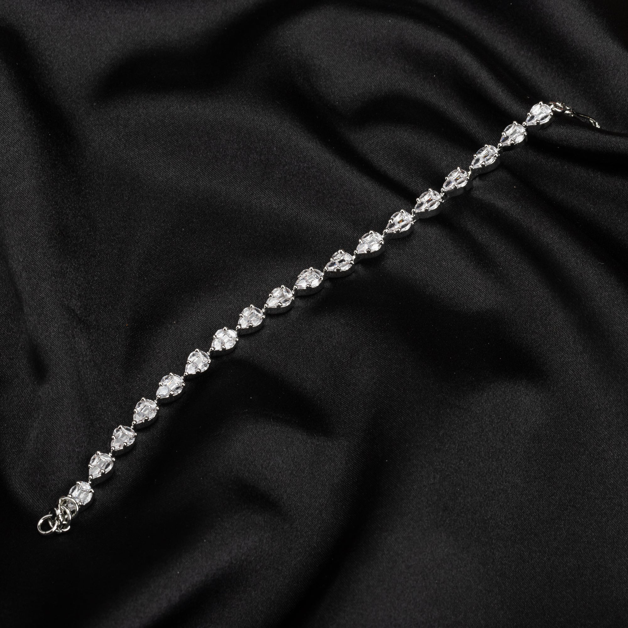 Silver zircon-studded chain bracelet, perfect for adding shimmer to your party wear.