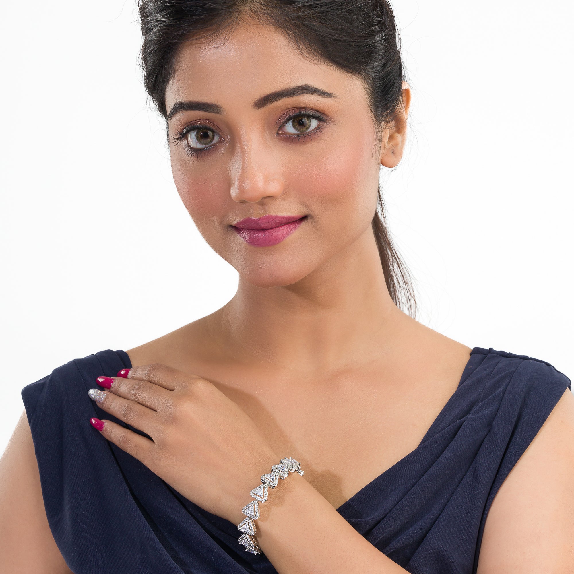 Silver zircon-studded chain bracelet adds sparkle and elegance to your party outfit.