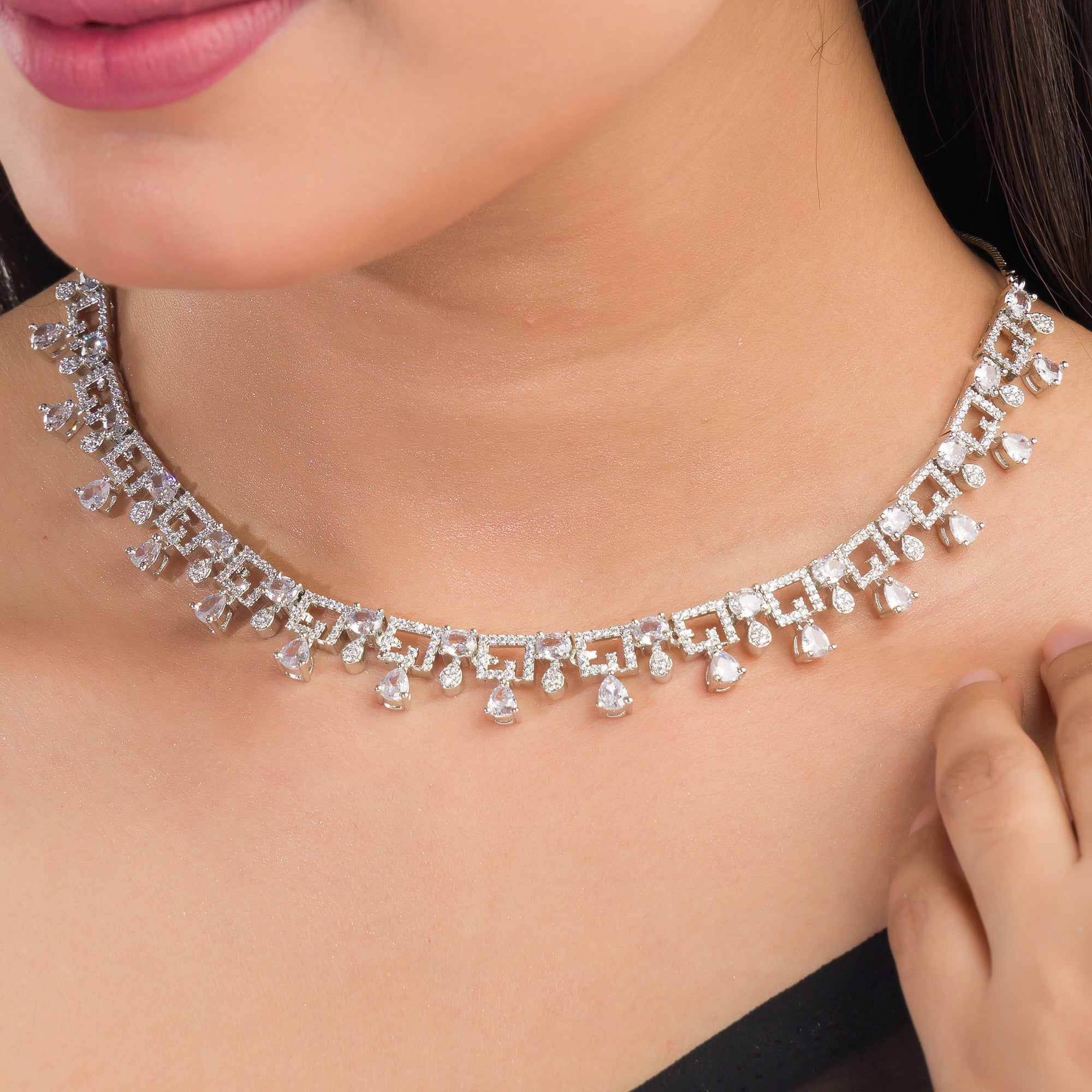 White zircon necklace set exudes elegance, featuring sparkling stones for a refined party look.