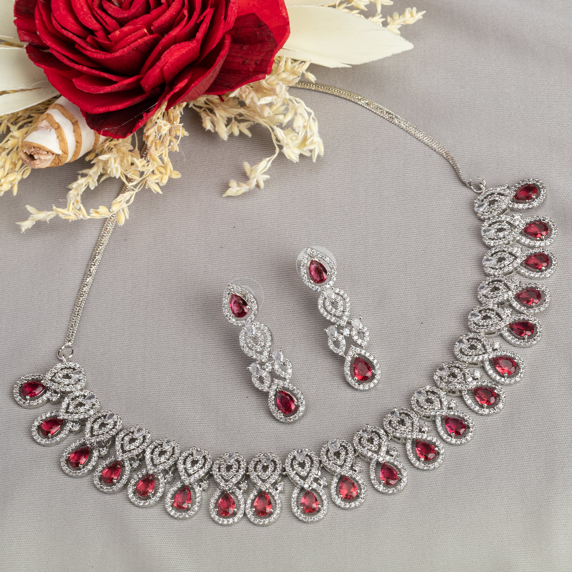 Bold red zircon necklace set, combining vibrant red stones with dazzling zircon sparkle for elegance.