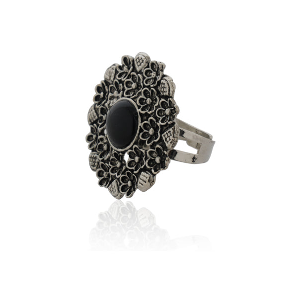 Vintage oxidized silver finger ring with intricate patterns and an antique finish.