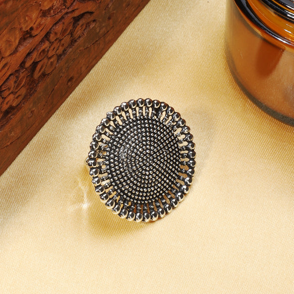 Oxidized silver finger ring with intricate patterns and antique finish for vintage charm.
