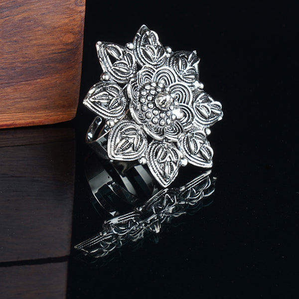 Vintage-inspired oxidized floral design finger ring with intricate patterns and antique finish.