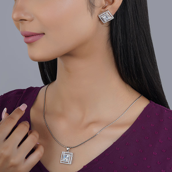 925 silver pendant set with zircon-studded earrings, adding sophisticated sparkle.