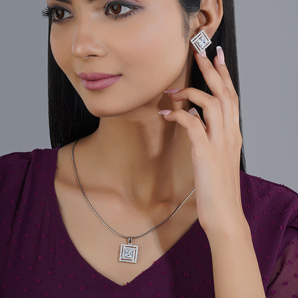 925 silver pendant set with zircon-studded earrings, adding sophisticated sparkle.