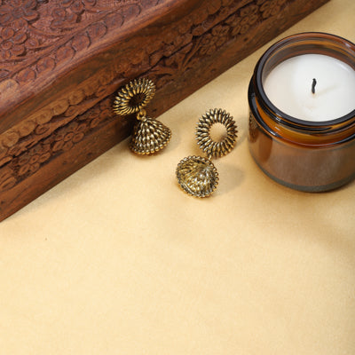 "Elegant oxidized jhumkas with golden detailing, merging traditional charm with a modern twist.