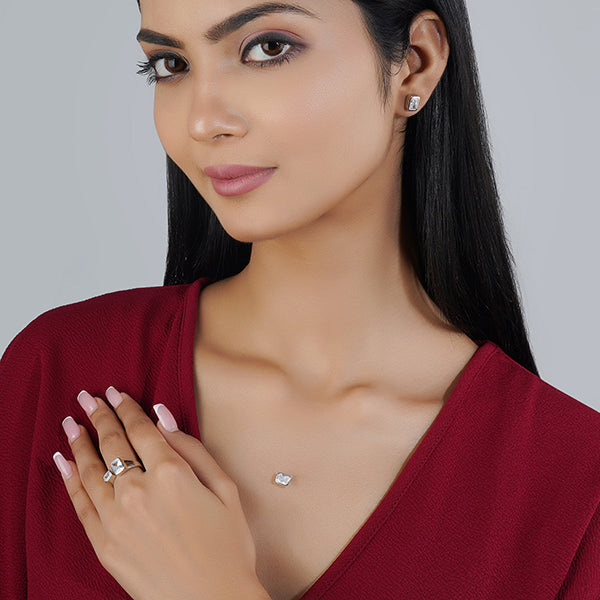 "925 silver pendant set with zircon stones, includes matching earrings and finger ring for a complete look."