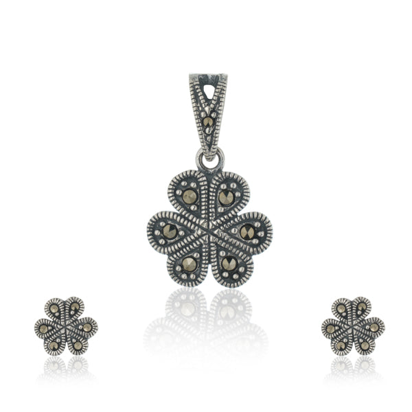"925 silver pendant and earrings set with floral design, exuding elegance and sophistication."