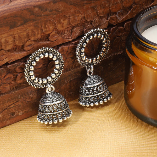 "Elegant oxidized silver jhumkas with intricate detailing, blending tradition & modern style."