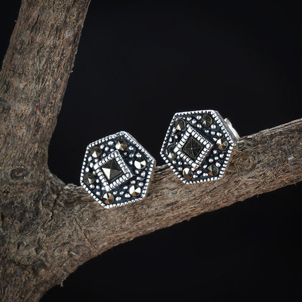 "925 sterling silver studs, timeless and versatile for elegant everyday wear."