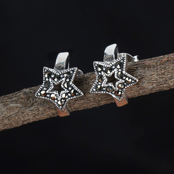"Classic 925 sterling silver studs, timeless and versatile for everyday elegance."