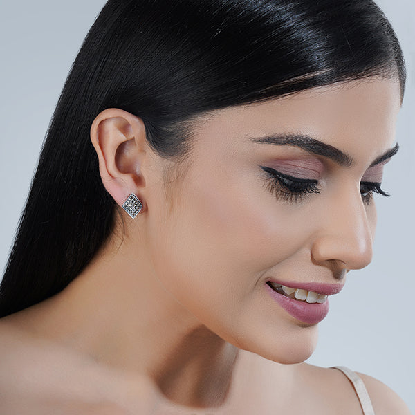 "Classic 925 sterling silver studs, offering timeless elegance and everyday versatility."