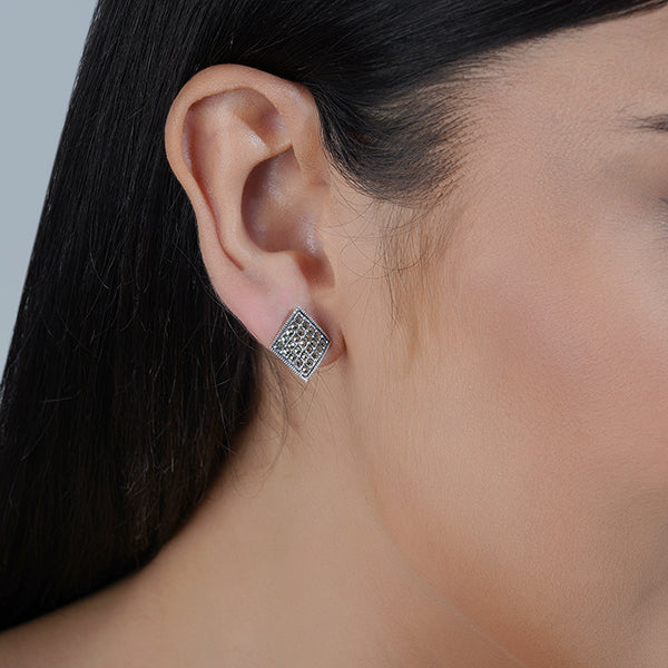 "Classic 925 sterling silver studs, offering timeless elegance and everyday versatility."