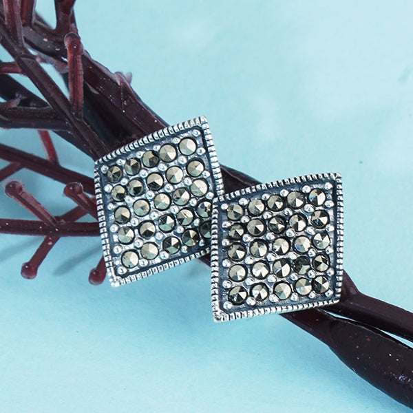 "Classic 925 sterling silver studs, offering timeless elegance and everyday versatility."