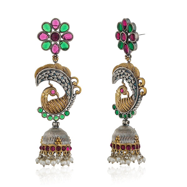 "Long oxidized jhumkas with peacock design, combining traditional elegance and intricate detailing."