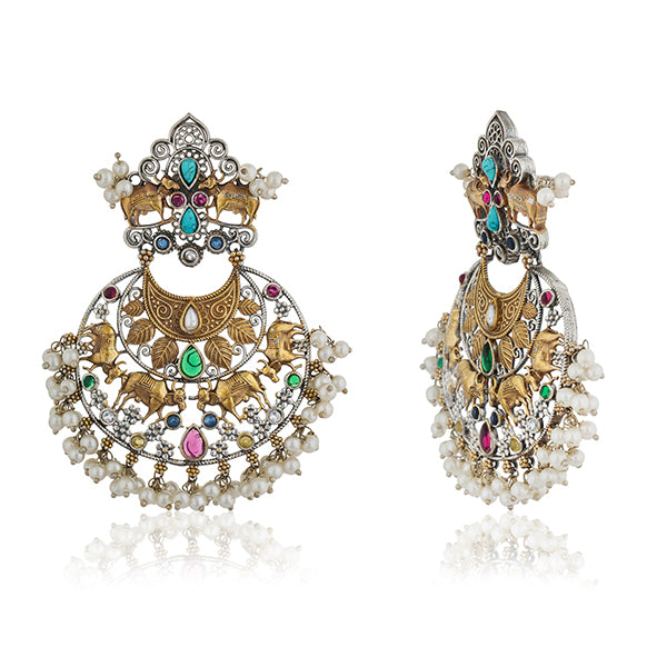 "Beautiful oxidized chandbali earrings with intricate designs and small pearls, offering a classic touch."