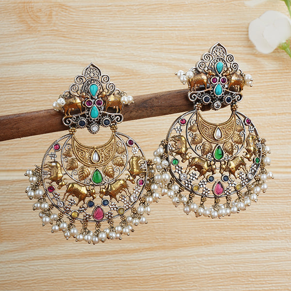 "Beautiful oxidized chandbali earrings with intricate designs and small pearls, offering a classic touch."